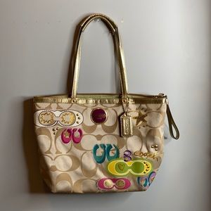 Coach gold sunglass logo design purse